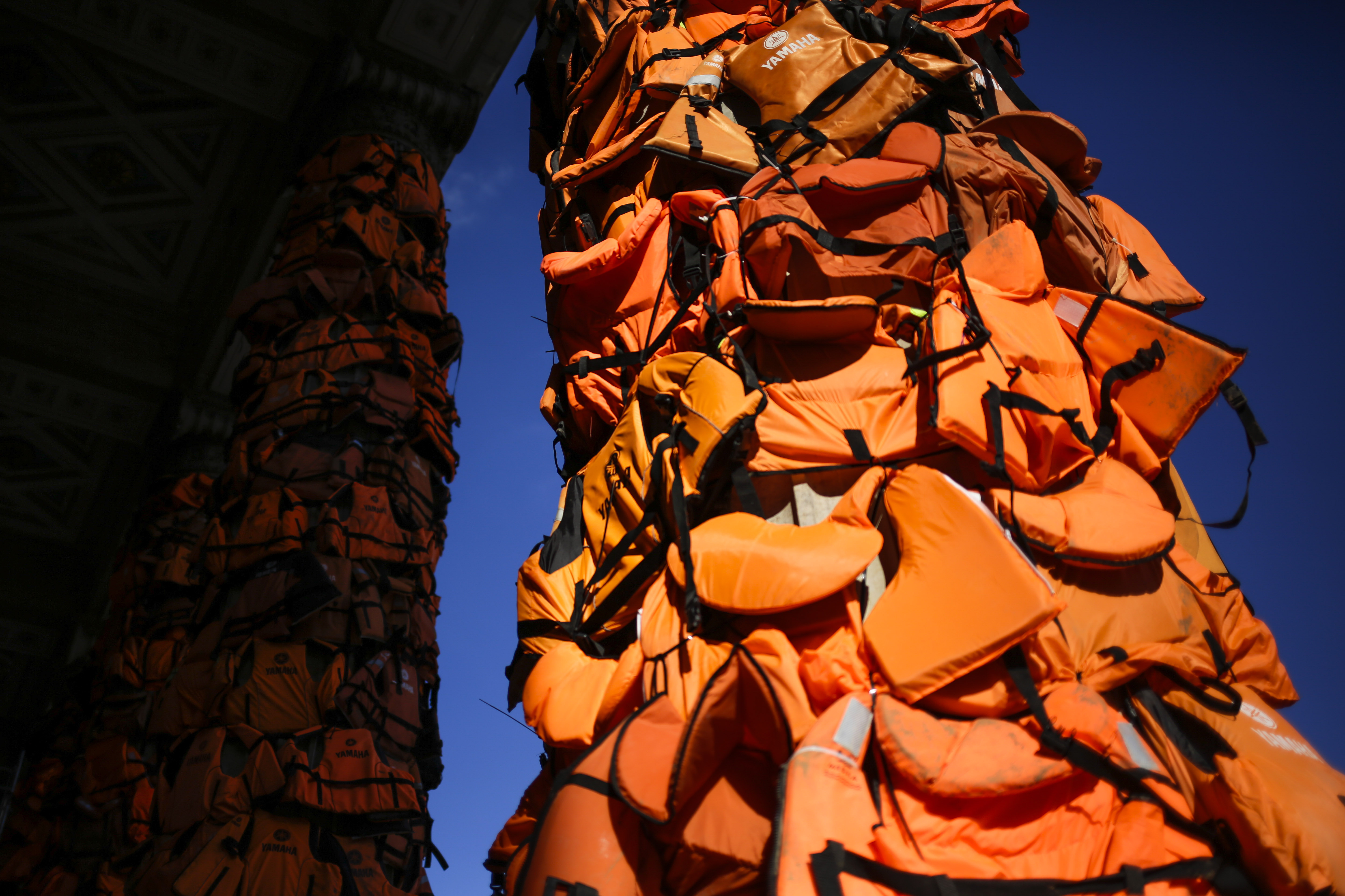 Происшествия: A art installation by Chinese artist Ai Weiwei with life vests used by refugees and collected on the Greek island of Lesbos is set up at the Konzerthaus Berlin (Concert Hall Berlin) for the Cinema For Peace gala alongside the 2016 Berlinale Film Festival in Berlin, Saturday, Feb. 13, 2016. The charity gala will take place at the Konzerthaus on Monday, Feb. 15, 2016. (AP Photo/Markus Schreiber)